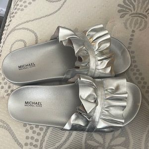 Brand new Michael Kors slides . Silver
